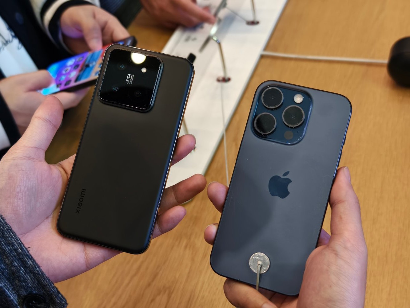 iPhone 15 Pro and Xiaomi 14 Pro side by side